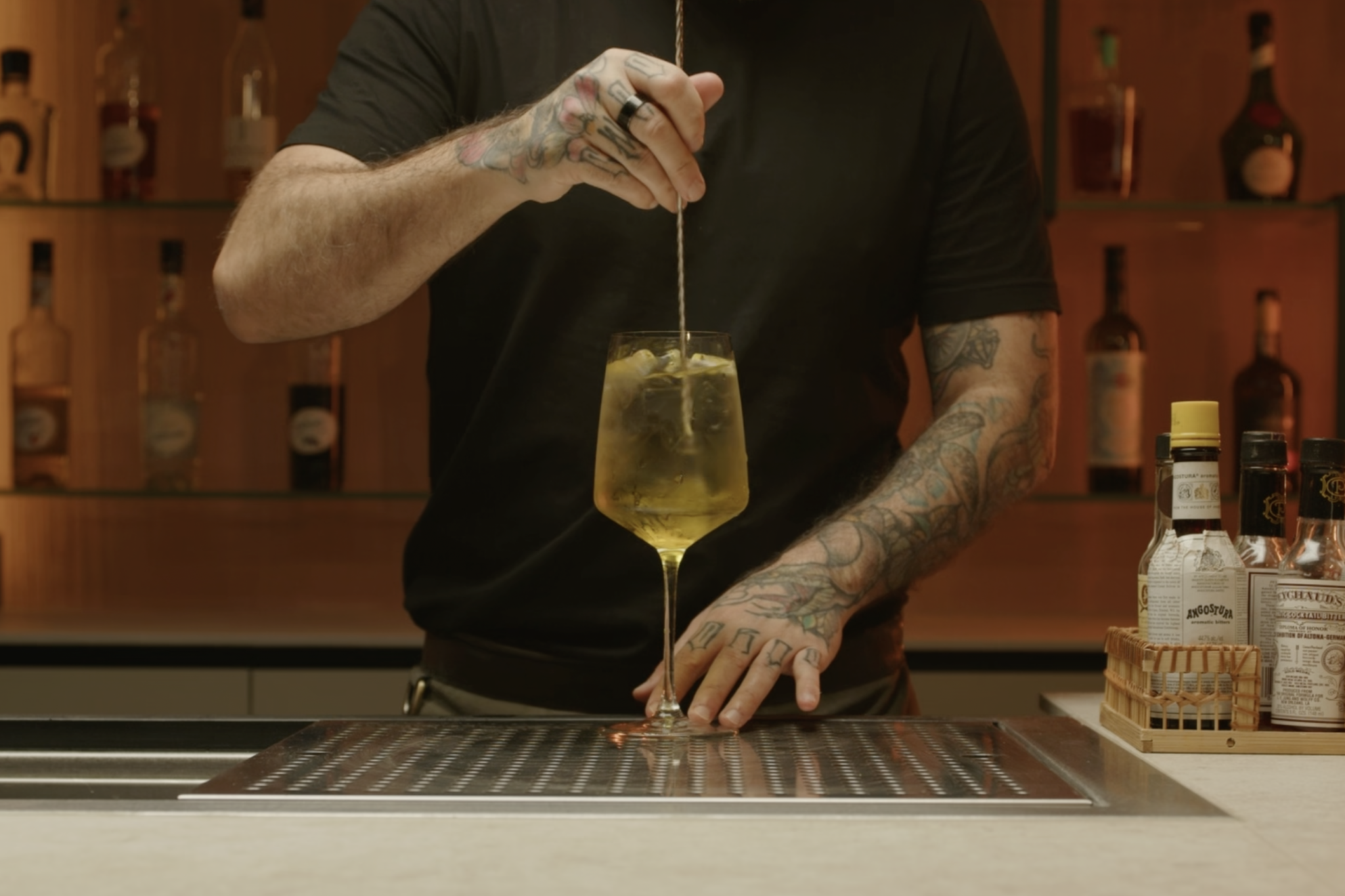 <p>Use a bar spoon to stir the ingredients gently, ensuring they are well combined.</p>