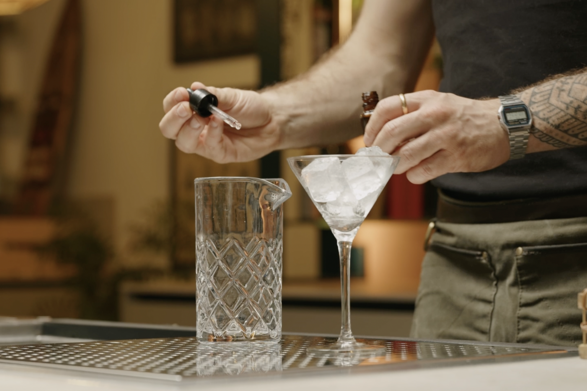 <p>Now, take a stirring glass and pour a dash of lime or lemon bitters inside. This small addition adds a subtle but essential layer of complexity to the cocktail and will enhance the citrusy undertones of the vermouth.</p>