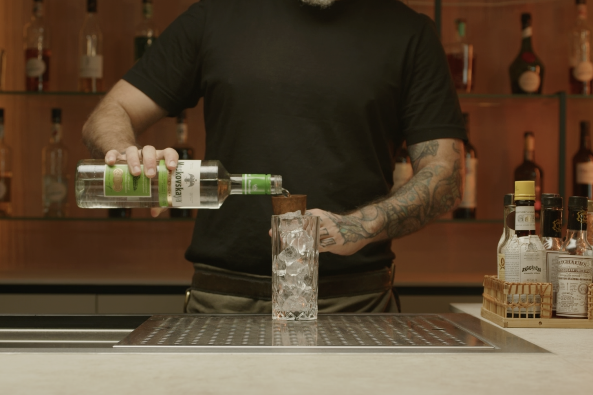 <p>Pour 1½ oz of vodka over the ice, providing the alcoholic base.</p>