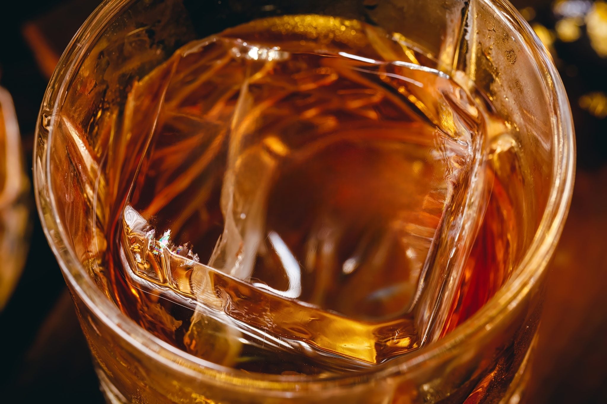 A close shot of a Whisky on the rock with a clear ice