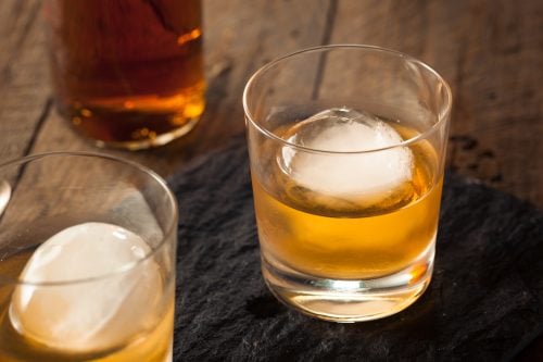 Sphere ice cubes in whiskey