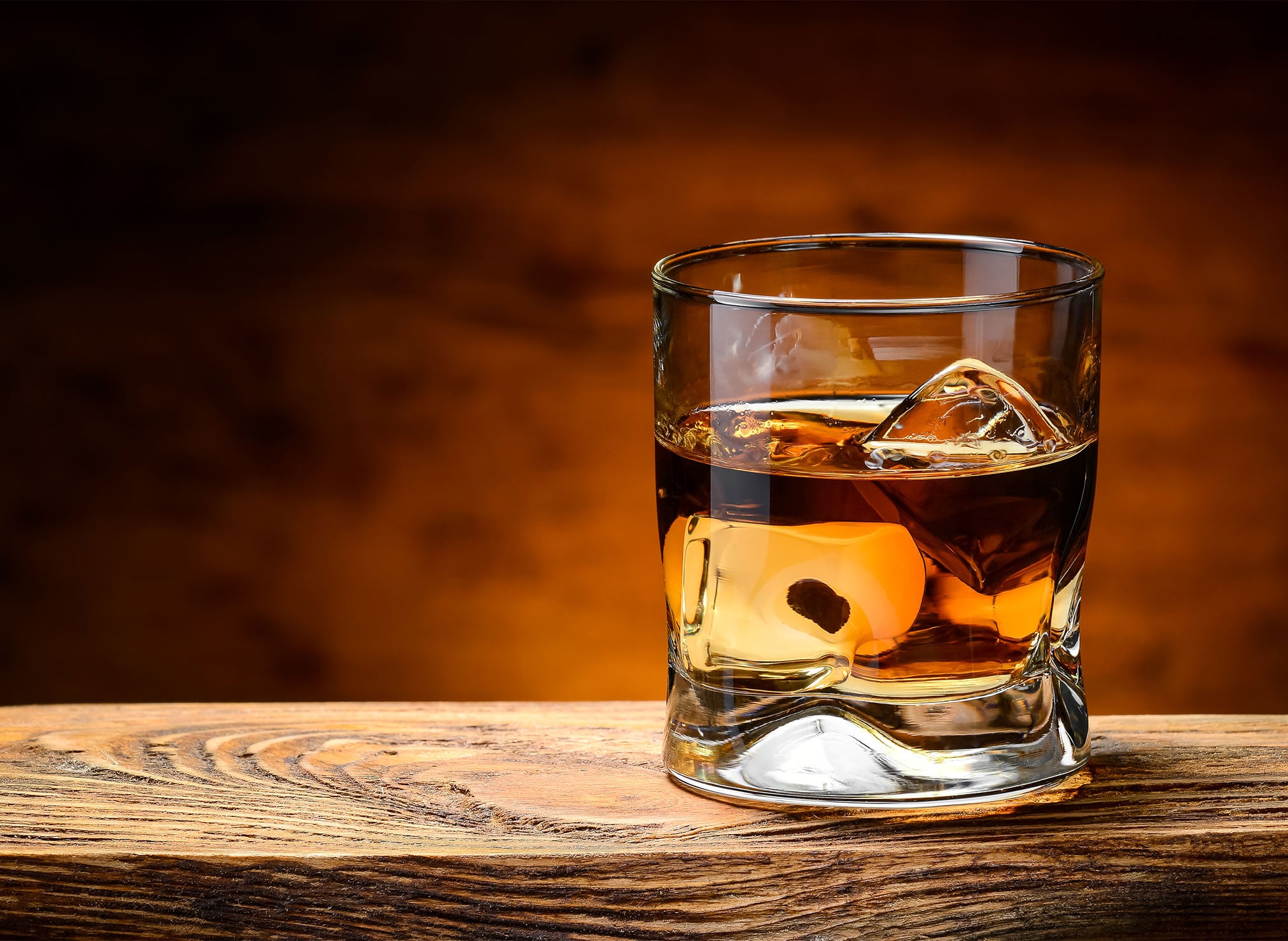 Whiskey glass sitting on table